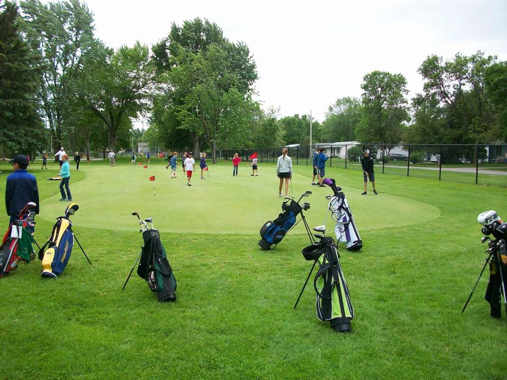 A group of people on the green.